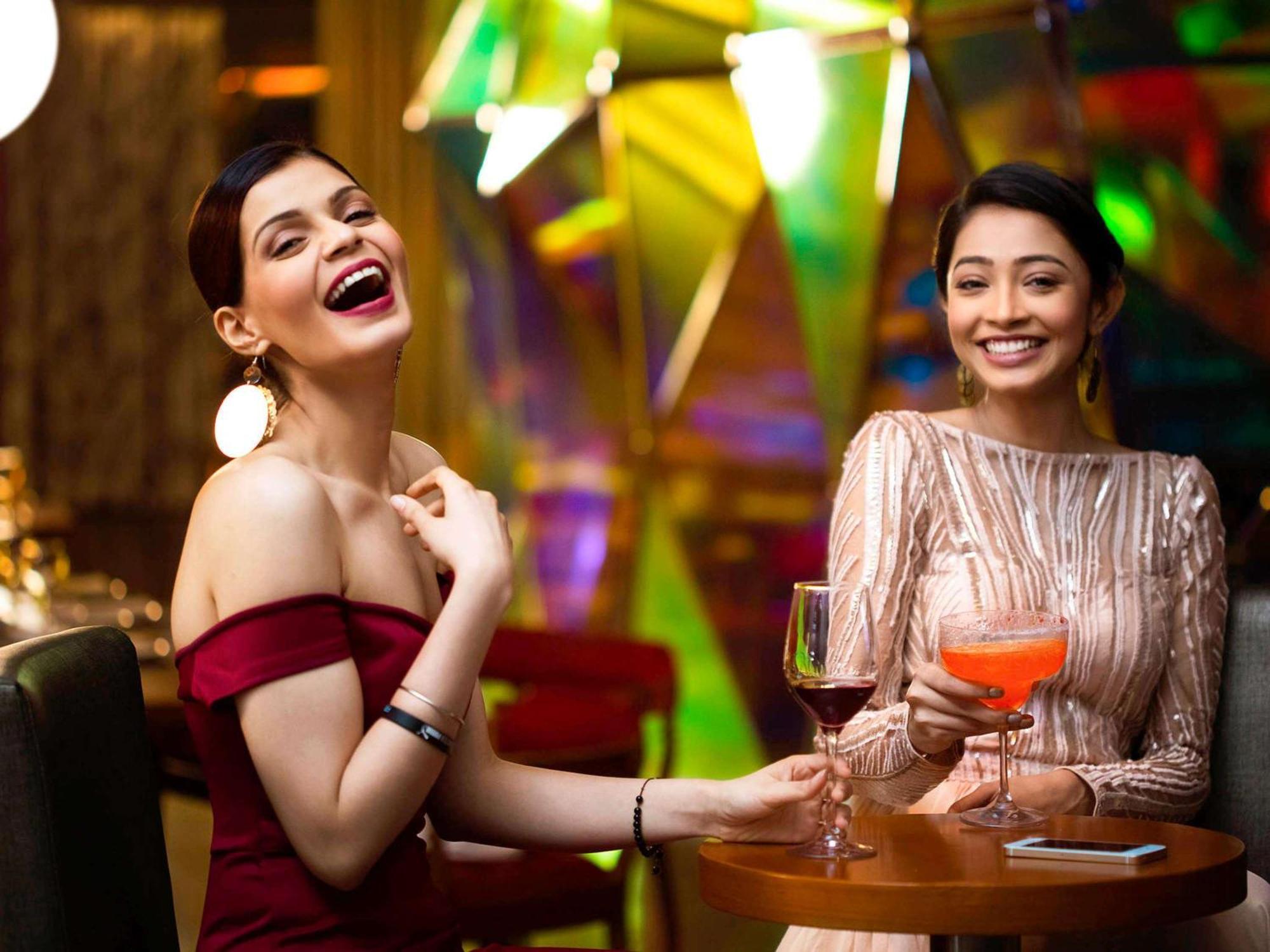 Novotel Kolkata Hotel And Residences Kültér fotó Two women socializing